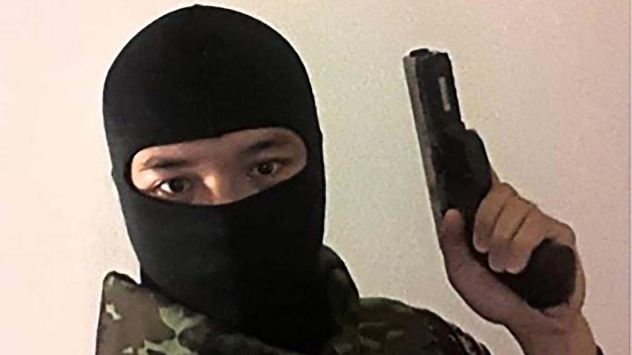 Another image on his page showed him masked and holding a gun. He also posted that he was looking for “vengeance” in the hours leading up to the massacre.