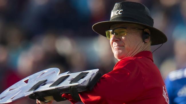 Umpire Bruce Oxenford uses new protective shield in match between Sri Lanka and England.
