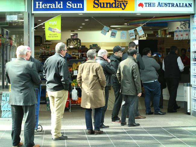 Dozens queue for a ticket to the $100 million Powerball at Southgate. Picture: David Caird