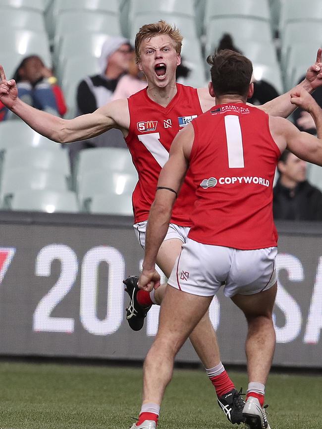 Maris Olekalns celebrates a goal with Aidan Tropiano during North Adelaide’s elimination final win. Picture Sarah Reed