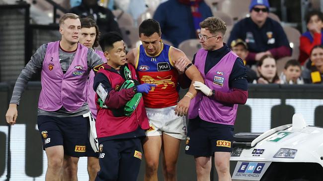 MELBOURNE – June 10: AFL. Hugh McCluggage of the Lions in the hands of trainers 4th qtr during the round 13 AFL match between Hawthorn and the Brisbane Lions at the MCG on June 9, 2023, in Melbourne, Australia. Photo by Michael Klein.