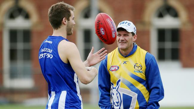 North Melbourne training at Aegis Park, Assistant coach Leigh Tudor talks with Luke McDonald. Melbourne. 10th September 2014. Picture: Colleen Petch
