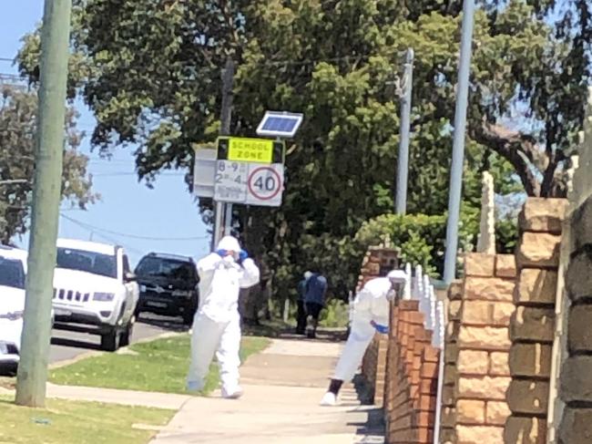 Forensics police at the scene on Harrow Rd.