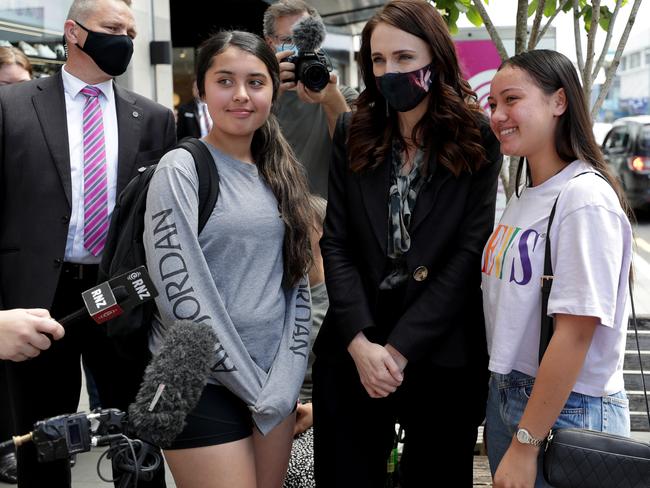 Jacinda Ardern poses with shoppers in Auckland. Picture: Getty Images.