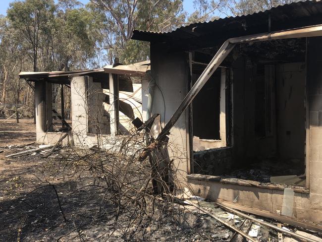 Burnt out remains of a home next to the custard apple orchards on Byfield Rd