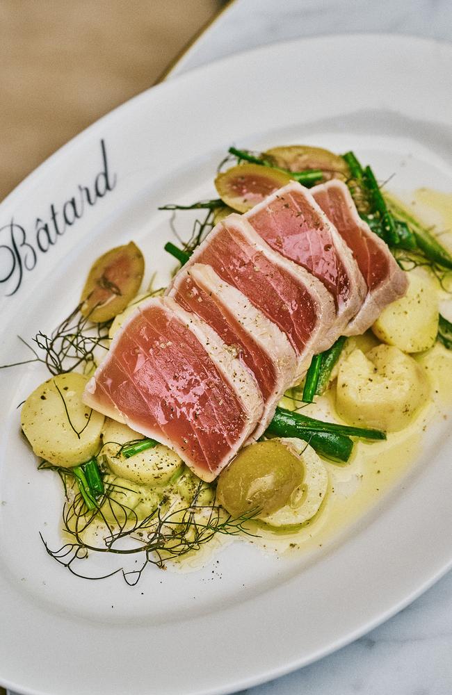 Tuna niçoise salad and those glorious ruby red fish tiles.