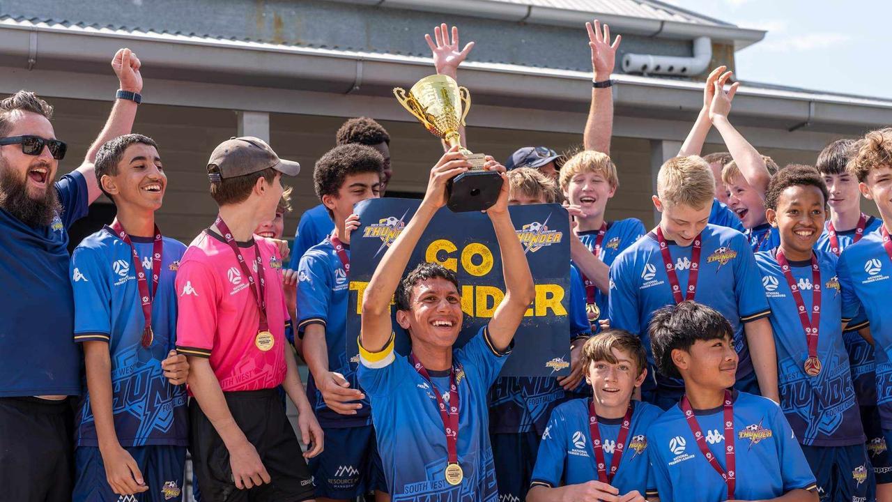 The SWQ Thunder U14 boys squad celebrate their grand final win.