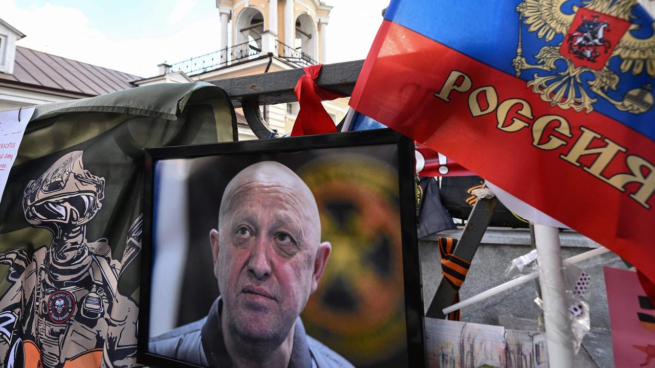 A portrait of late head of Wagner paramilitary group, Yevgeny Prigozhin displayed at a makeshist memorial in Moscow. (Photo by NATALIA KOLESNIKOVA / AFP)