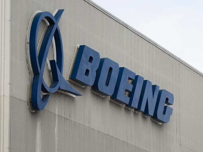 In this file photo taken on March 12, 2019 the Boeing logo is pictured at the Boeing Renton Factory in Renton, Washington. - Newly-disclosed documents "appear to point to a very disturbing picture" about Boeing's response to safety issues regarding the 737 MAX, a US congressional aide told AFP on December 24, 2019. Boeing sent the documents "late in the evening" Monday just hours after ousting Dennis Muilenburg as chief executive, according to the aide with the US House Transportation Committee (Photo by Jason Redmond / AFP)