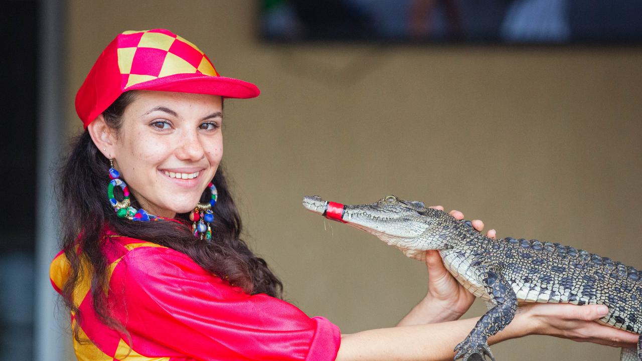 Croc racing at the Berry Springs Tavern for Melbourne Cup Day: Bartender and ‘jockey’ Gypsy Cass with one of the competing crocs. Picture: GLENN CAMPBELL