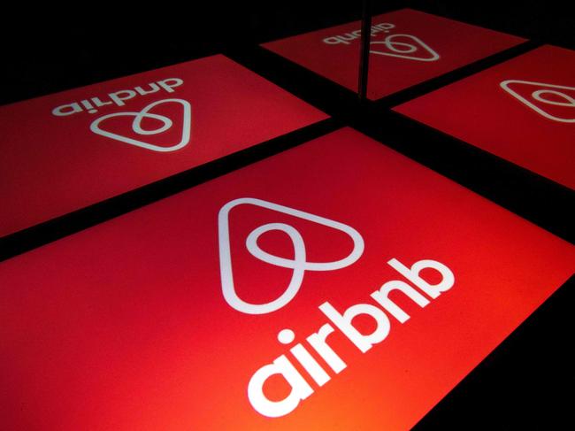 (FILES) This file photo illustration picture taken on November 22, 2019, shows the logo of the online lodging service Airbnb displayed on a tablet in Paris. - Airbnb and Google on January 13, 2021 unveiled steps aimed at heading off attacks on US democracy as inauguration day neared for President-elect Joe Biden. The leading home-sharing platform put out word it is banning bookings in Washington around the time of Biden's January 20, 2021 inauguration after local authorities asked people to stay away following the attack on the US Capitol. (Photo by Lionel BONAVENTURE / AFP)