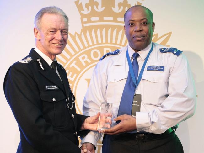 Met Police Commissioner Bernard Hogan-Howe with Idris Bada who identified 638 people in one year. Picture: Met Police.