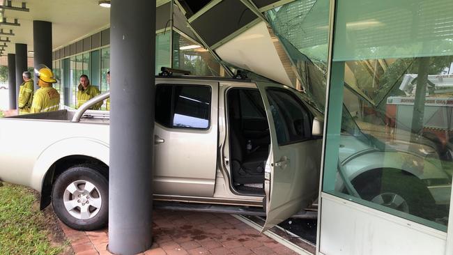 A ute has crashed its way through the front doors of the City of Palmerston council building in a freak accident. Picture: PFES Media