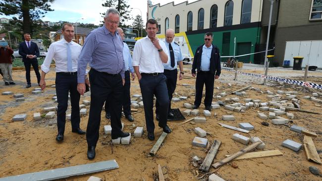 NSW Premier Mike Baird surveys the damage at Collaroy beach with Brad Hazzard, member for Wakehurst. Residents return to their homes to assess the damage caused by storms and flooding, after being evacuated on the Northern Beaches in Sydney. Britta Campion / The Australian.