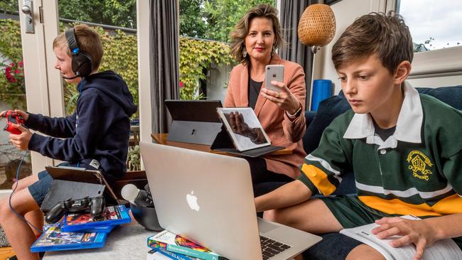 Belinda Donaldson works from home while her sons Lenny, 9, and Archer, 12. Picture: Jake Nowakowski