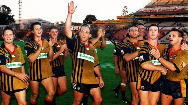 Members of the Crushers team wave goodbye to fans.