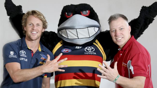 Adelaide Crows player Rory Sloane and Bendigo Bank Senior Manager of Group Sponsorship Brad Polling with Claude the Crow's Mascot. Picture: Dean Martin.