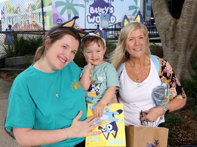 Sam Hargrave and son Tommy, 2, with Sonia Selvester with their Bluey merchandise from Bluey’s World.