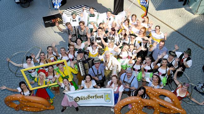 September 2017: Performers pose for a photo at the biggest Oktoberfest party outside of Bavarian Bier Cafe at the Eagle Street Pier. Picture: Bradley Kanaris/AAP