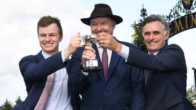 Tom Dabernig (right) celebrating Fifty Star’s win in the Australian Cup with Ben and David Hayes last year. Picture: AAP