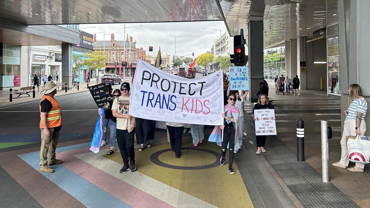 The group marched over the Yarra St pride flag.