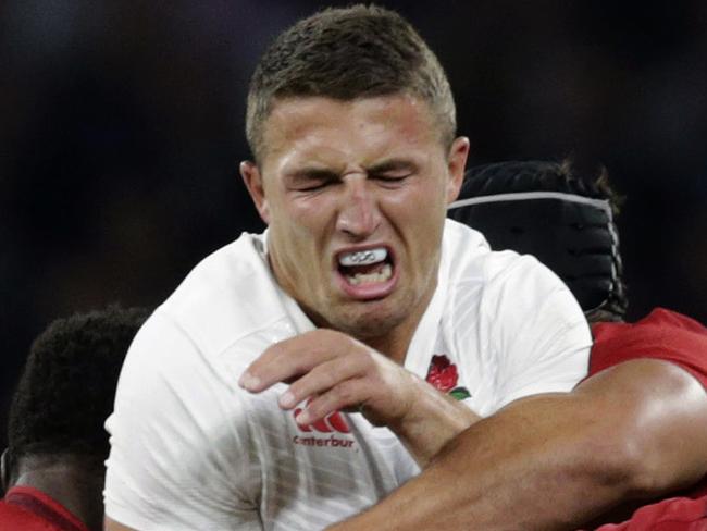 England’s Sam Burgess, centre is tackled by France’s Flugence Ouedraogo, left and France’s Yoann Maestri right, during an international friendly rugby match between England and France at Twickenham stadium in London, Saturday, Aug. 15, 2015. A series of friendly internationals are being held in advance of the upcoming Rugby World Cup that starts in September. (AP Photo/Alastair Grant)