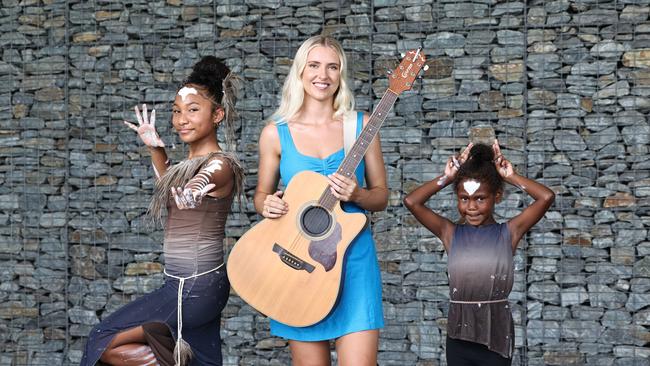 Cairns Regional Council will be celebrating Australia Day with their annual Citizen of the Year awards, followed by a free concert at Munro Martin Parklands. Sand &amp; Sea dancers Lolarose Lyons, 12, and Karla-Rose Rocky, 6, pictured with Social Hour musician Anais Campbell, will all perform at the free, family friendly concert on Australia Day. Picture: Brendan Radke