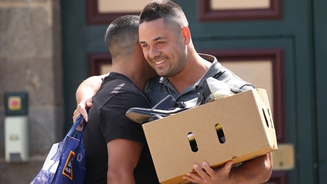 Hayne embraces a man upon his release. Picture: NCA NewsWire / Gary Ramage              Picture: NCA NewsWire / Gary Ramage