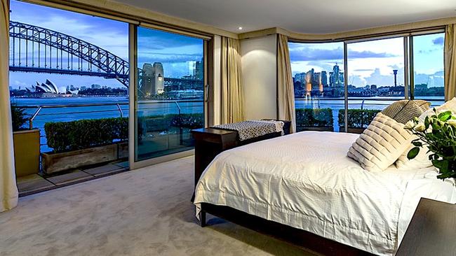 The main bedroom has a sweeping panorama of the city and Sydney Harbour Bridge.