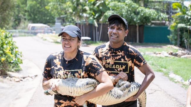 Contestants Dwes and Katherine wrangle a croc on The Amazing Race Australia.