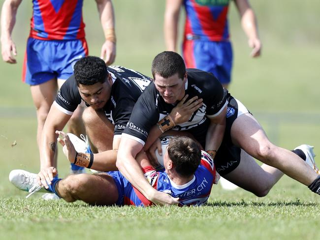 Jack Hilliar is tackled. Picture: Michael Gorton