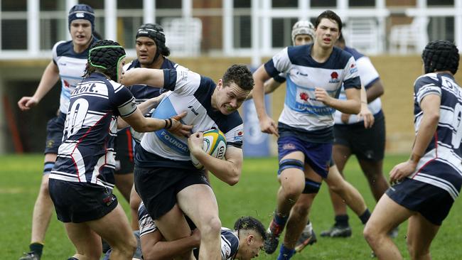 NSW Barbarian's William Clark with the ball in the match against Victoria