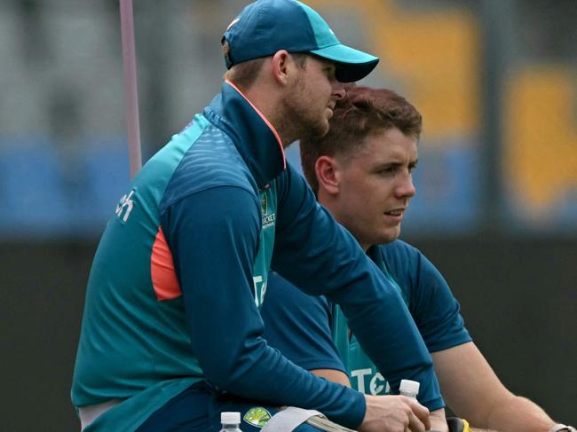 Australia's Steve Smith (L) and Cameron Green speak during a practice session on the eve of their 2023 ICC Men's Cricket World Cup one-day international (ODI) match against Afghanistan at the Wankhede Stadium in Mumbai on November 6, 2023. (Photo by Indranil MUKHERJEE / AFP) / -- IMAGE RESTRICTED TO EDITORIAL USE - STRICTLY NO COMMERCIAL USE --