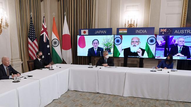 US President Joe Biden (L), with Secretary of State Antony Blinken (2nd L), meets virtually with members of the "Quad" alliance of Australia, India, Japan and the US, in the State Dining Room of the White House. Picture: AFP