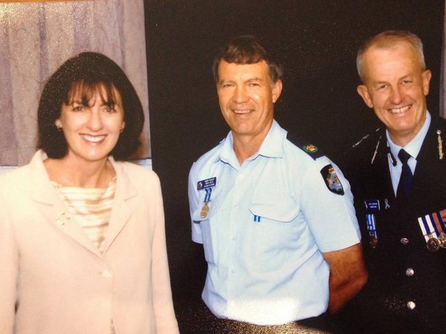 Officer-in-charge of Ayr police station, Senior Sergeant Michael Isles, pictured with then-Minister for Police and Corrective Services, Judy Spence and then-Commissioner of Police Bob Atkinson. Snr Sgt Isles went missing on duty in Ayr in 2009. Picture: Facebook