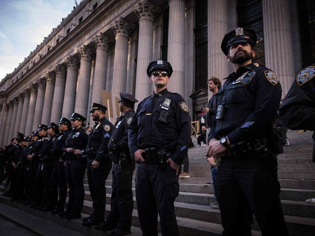 Police officers line up outside Madison Square Garden as former US President and Republican presidential candidate Donald Trump holds the campaign rally. Picture: AFP