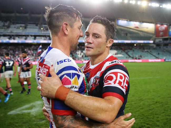 Newcastle's Mitchell Pearce comes together at full time with Roosters Cooper Cronk after the Sydney Roosters v Newcastle Knights rugby league match at Allianz Stadium, Sydney. Picture: Brett Costello