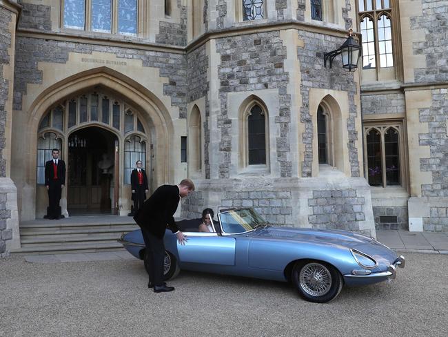 The Duke and Duchess drove an E-Type Jaguar to the reception. Picture: AFP