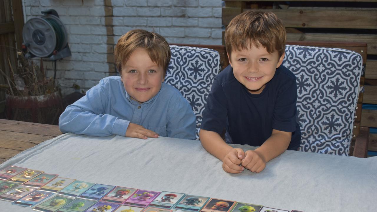 Cannonvale boys Ocean (left) and Jack (right) Thomas are taking on the collectable card business. Picture: Estelle Sanchez