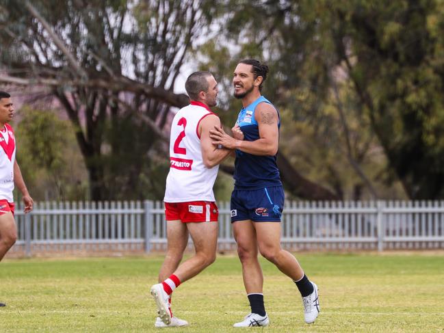 Former Territory Thunder teammates Abe  Ankers (Federal) and Cameron Ilett (Rovers) have a quick chat.