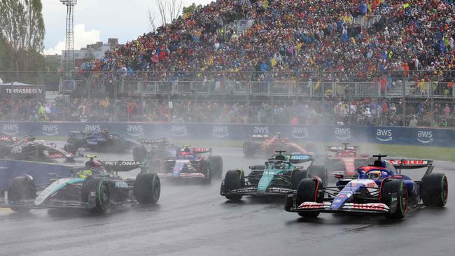 Ricciardo on the outside lost out on the opening lap. (Photo by CHARLY TRIBALLEAU / AFP)