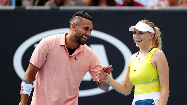 Nick Kyrgios shares a joke with mixed doubles partner Amanda Anisimova. Picture: Mark Stewart