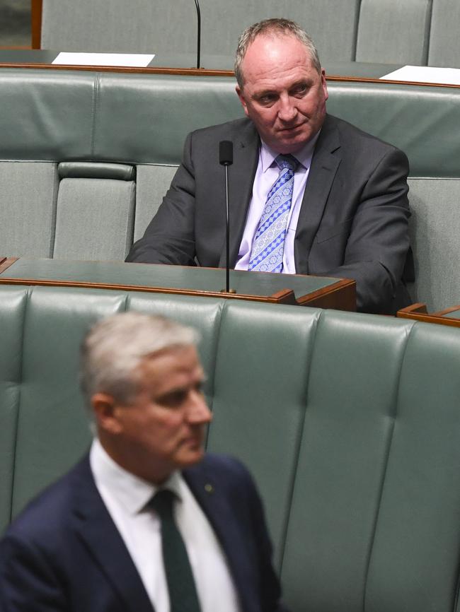 Nationals MP Barnaby Joyce watches on as his leader, Michael McCormack, arrives for Question Time last week. Picture: AAP