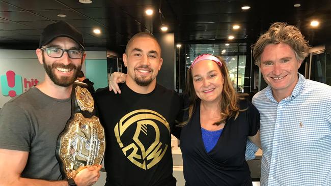 Former radio anchor Jack Laurence (left) with MMA star Robert Whittaker, Kate Langbroek and Dave Hughes at the Hit Network. Picture: Supplied