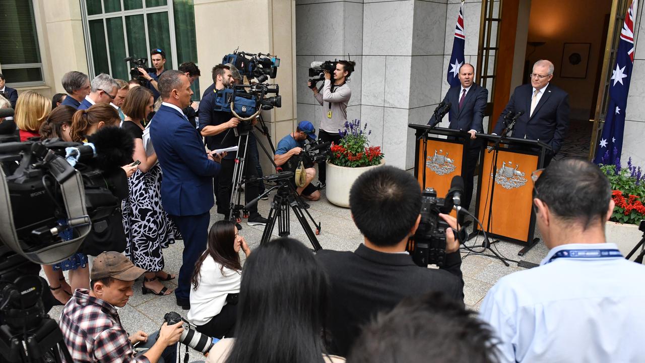 Prime Minister Scott Morrison (right) and Treasurer Josh Frydenberg speak to the media today. Picture: Mick Tsikas/AAP