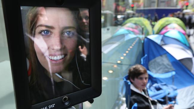 Lucy the robot was first in line outside the Apple store for the new iPhone to go on sale. Photo: Bob Barker.