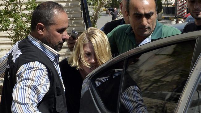 Tara Brown is taken from a Lebanese courthouse after the botched attempt to retrieve the children.