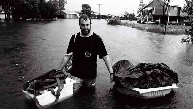 February 1992 flood. John Parkin, of Coolum, helped a friend rescued his belongings at Pacific Paradise.