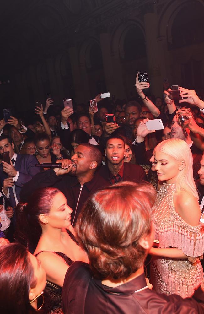 Dozens of people recorded the tight-knit Kardashian-Jenner family while Kanye performed.