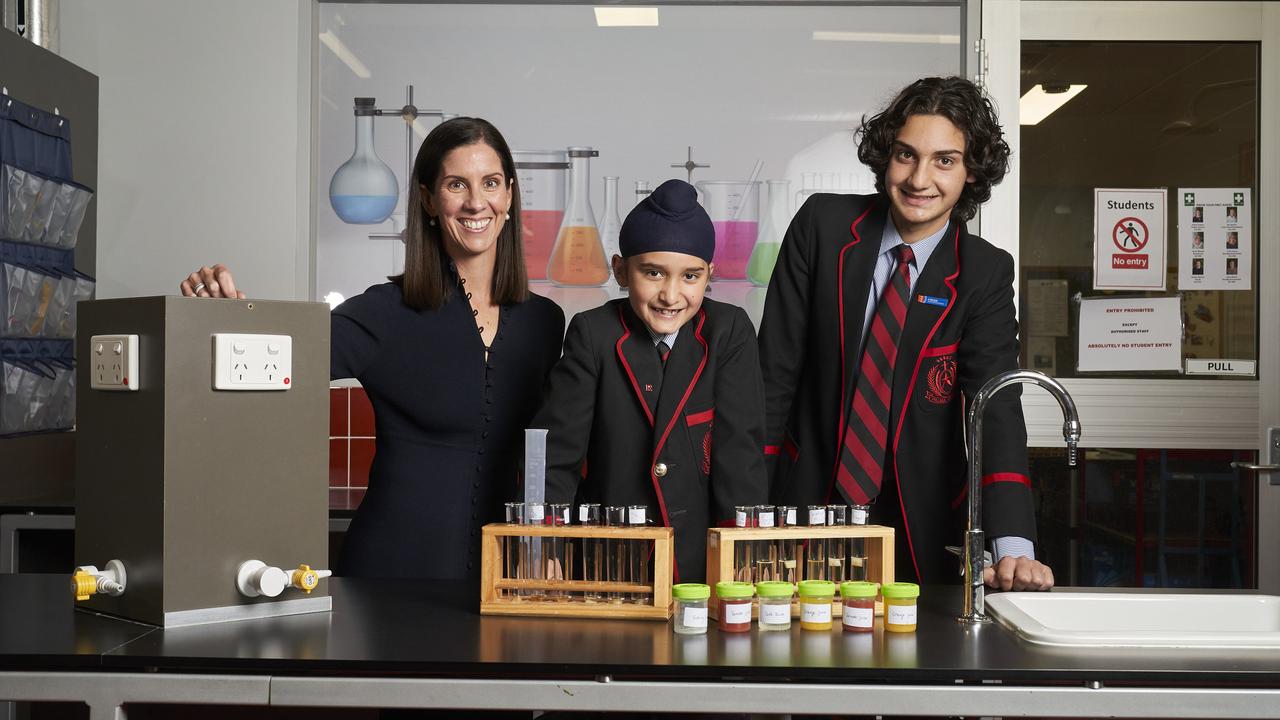 Shana Bennett, with year 2 student Aekas, 7 and year 9 student, Domenic, 14 at Rostrevor College in Woodforde. Picture: Matt Loxton